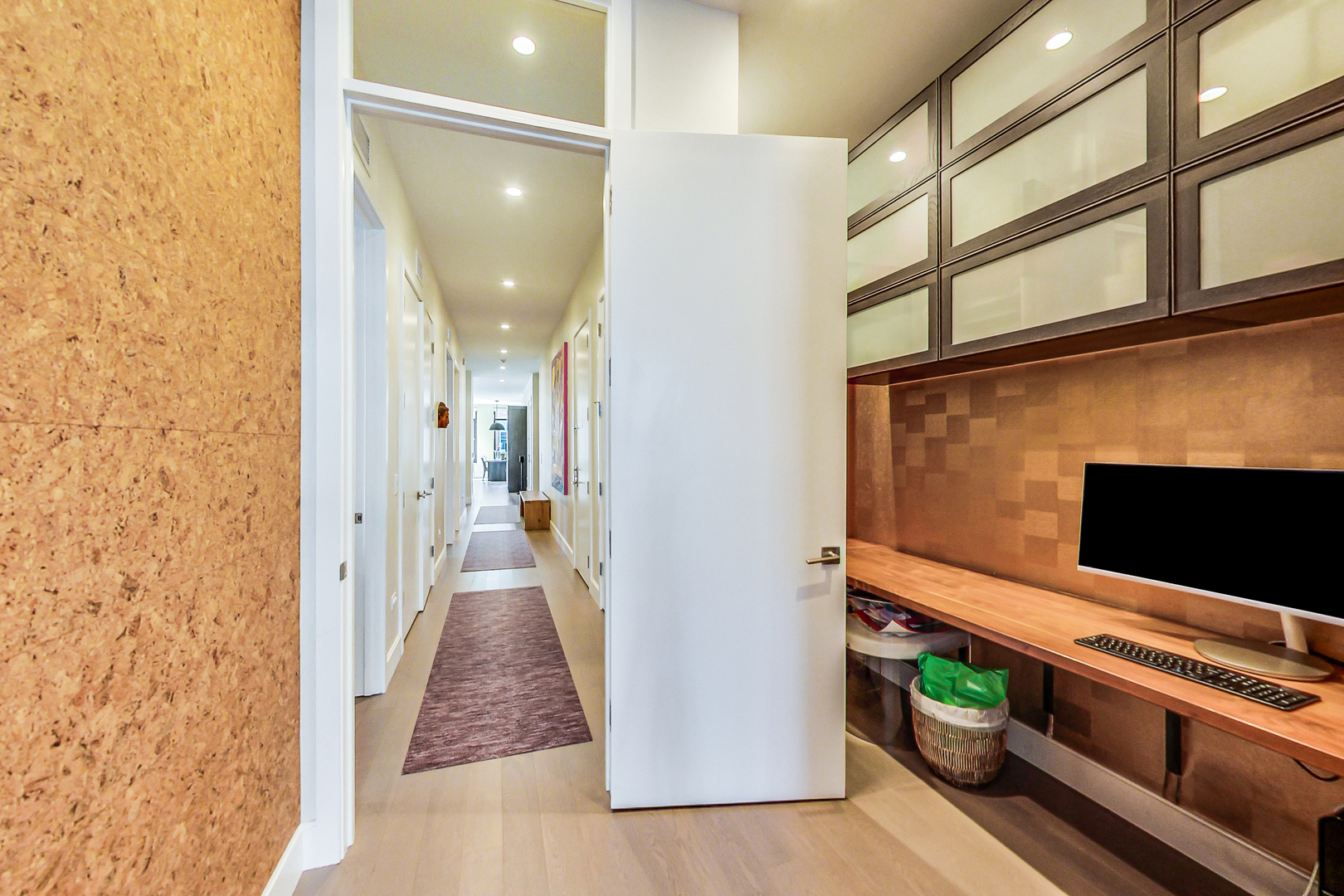 40 North Carpenter Street, Unit 5N Chicago, IL 60607 - Photo 26 of 29 a view of a hallway with wooden floor and staircase