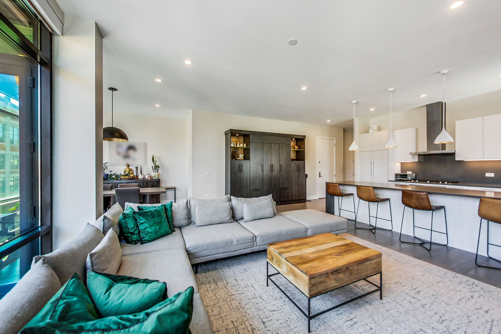 40 North Carpenter Street, Unit 5N Chicago, IL 60607 - Photo 4 of 29 a living room with furniture and kitchen view