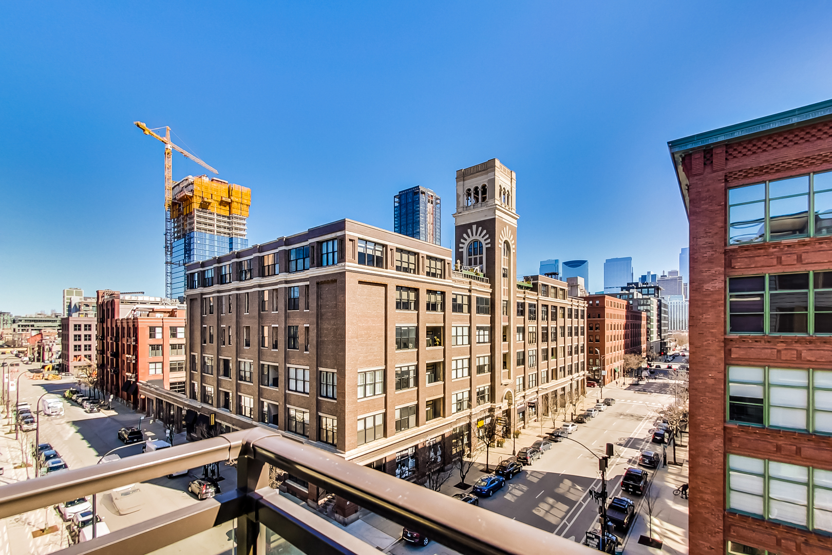 40 North Carpenter Street, Unit 5N Chicago, IL 60607 - Photo 8 of 29 front view of a building with a street