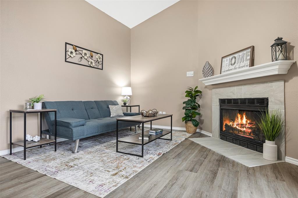 4113 Esters Road, Unit 609 Irving, TX 75038 - Photo 8 of 24 a living room with furniture and a fireplace