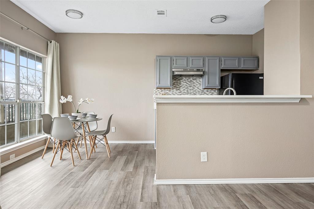 4113 Esters Road, Unit 609 Irving, TX 75038 - Photo 10 of 24 a dining room with furniture and wooden floor
