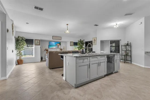 a kitchen with cabinets and window