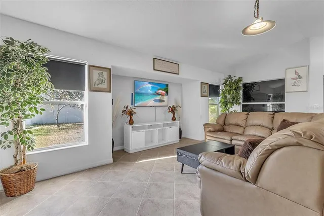 a living room with furniture and a window