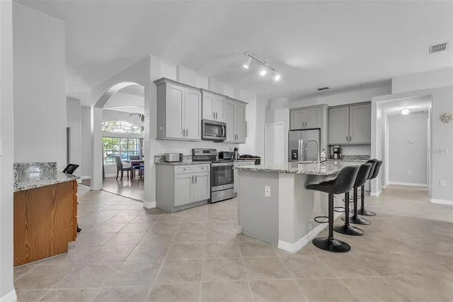 a kitchen with kitchen island cabinets and counter space
