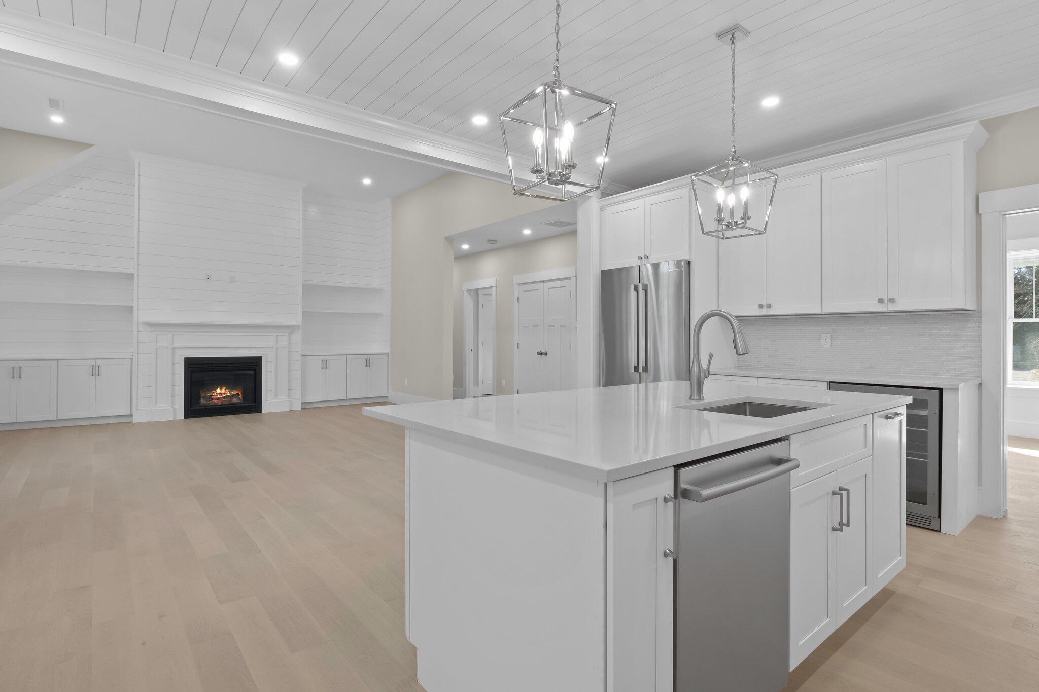 28 Yardarm Drive Mashpee, MA 02649 - Photo 13 of 38 a kitchen with kitchen island a sink stainless steel appliances and a chandelier