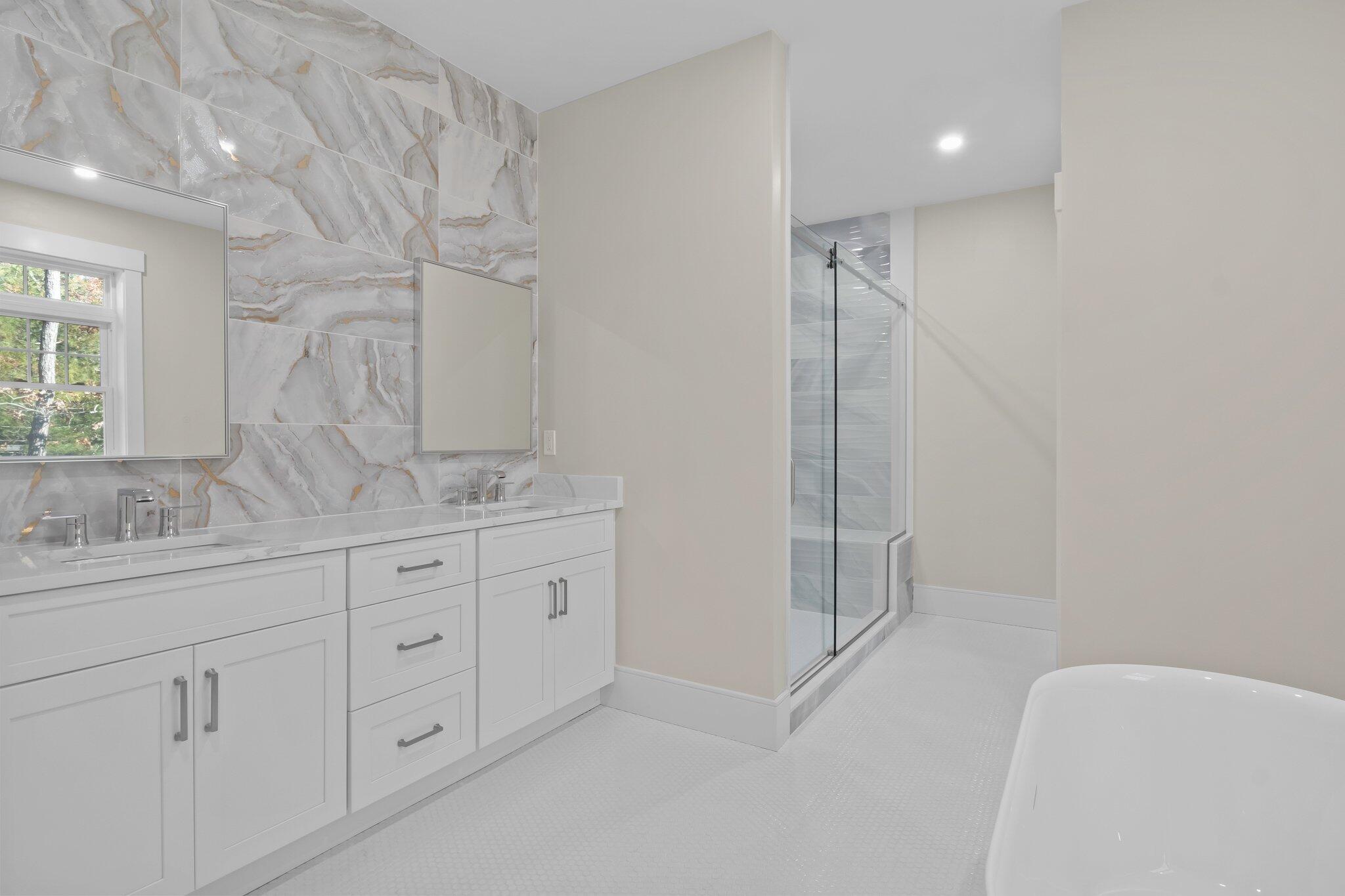 28 Yardarm Drive Mashpee, MA 02649 - Photo 26 of 38 a bathroom with a granite countertop sink a mirror and a shower