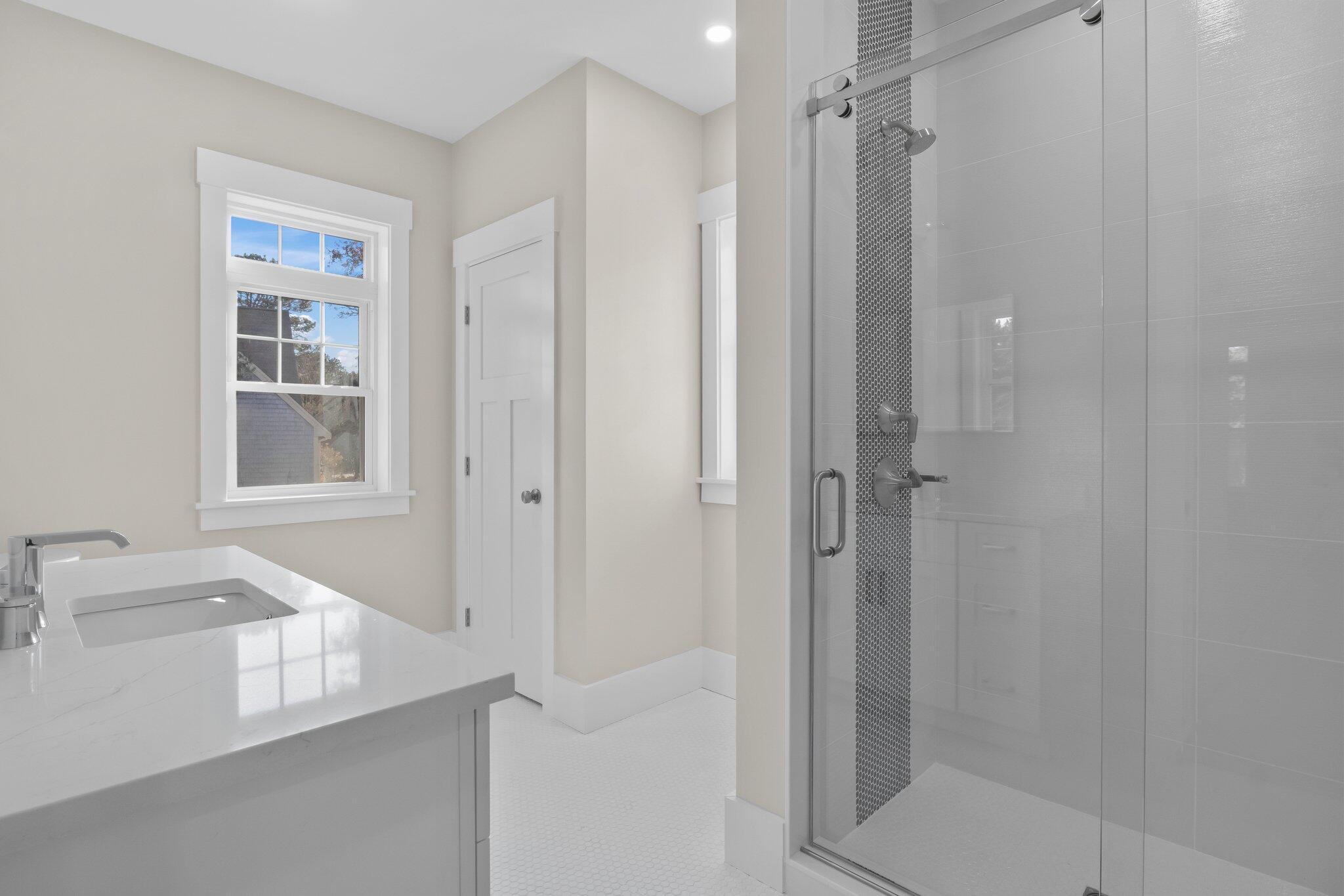 28 Yardarm Drive Mashpee, MA 02649 - Photo 31 of 38 a bathroom with a shower and a sink