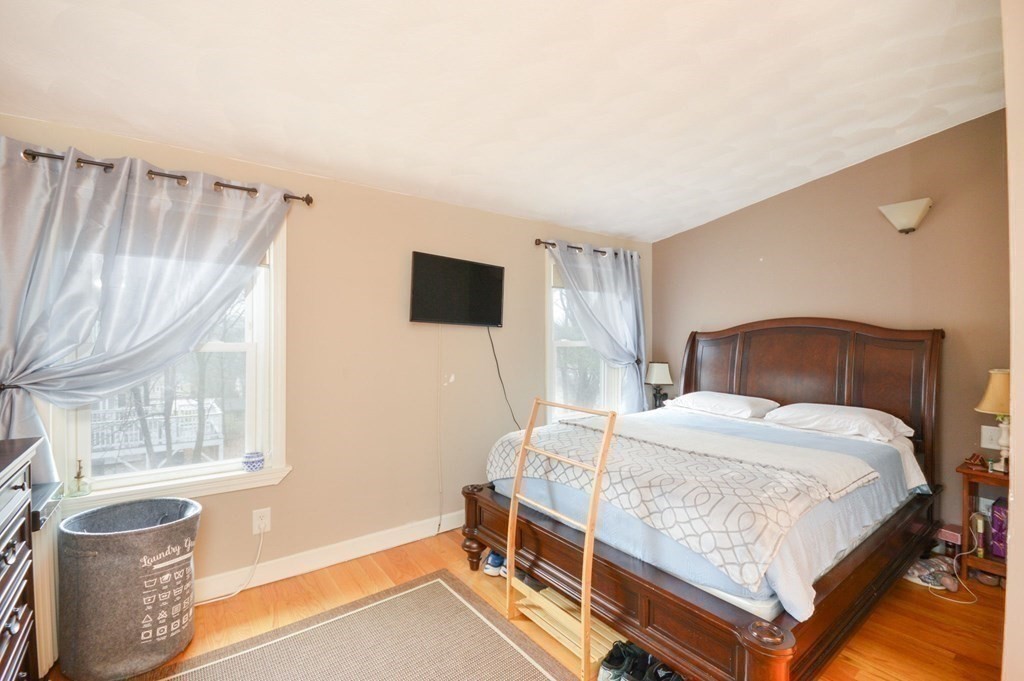 3 Hunnewell Street Melrose, MA 02176 - Photo 13 of 33 a bedroom with a bed and a window