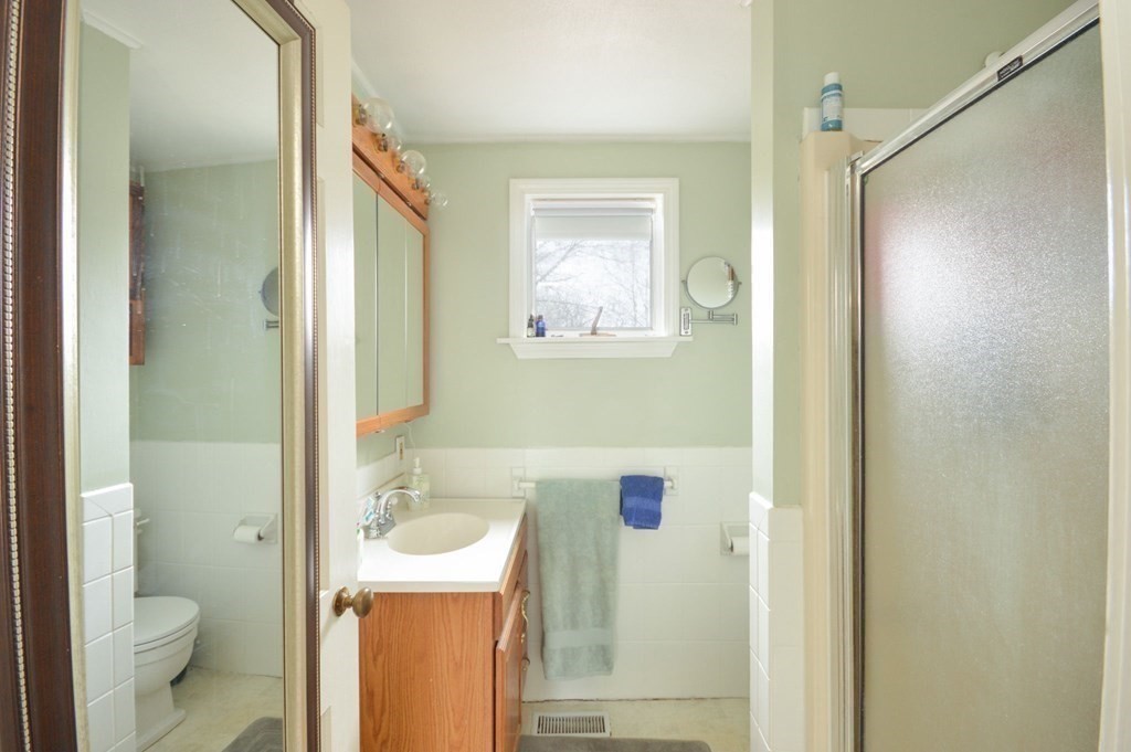 3 Hunnewell Street Melrose, MA 02176 - Photo 14 of 33 a bathroom with a sink a toilet and shower