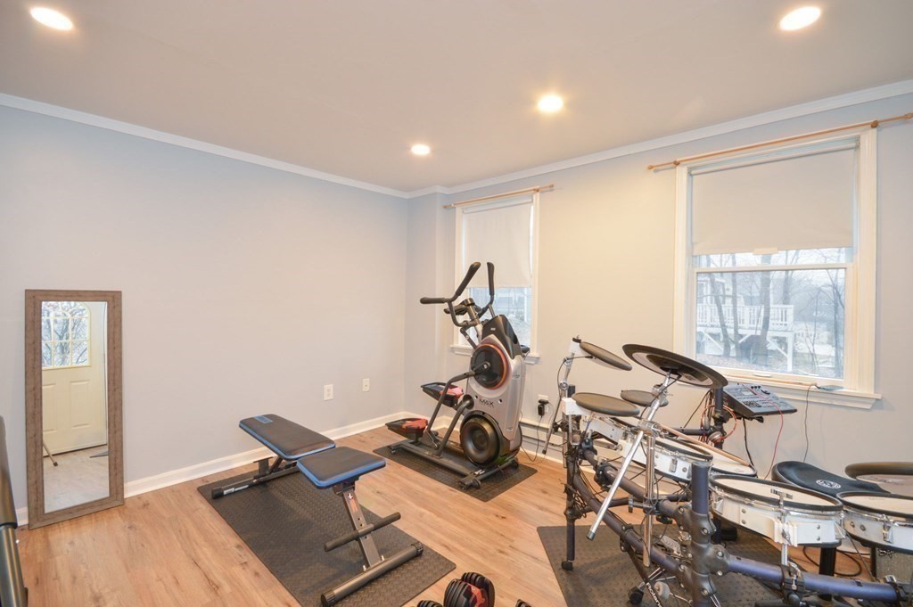 3 Hunnewell Street Melrose, MA 02176 - Photo 17 of 33 a room with gym equipment and a large window