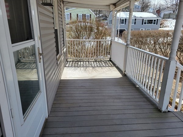 3 Hunnewell Street Melrose, MA 02176 - Photo 3 of 33 a view of a balcony with wooden floor