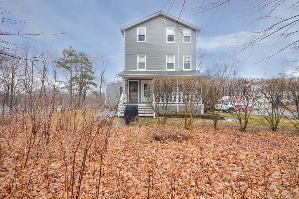 3 Hunnewell Street Melrose, MA 02176 - Photo 4 of 33 a view of a brick house with a yard