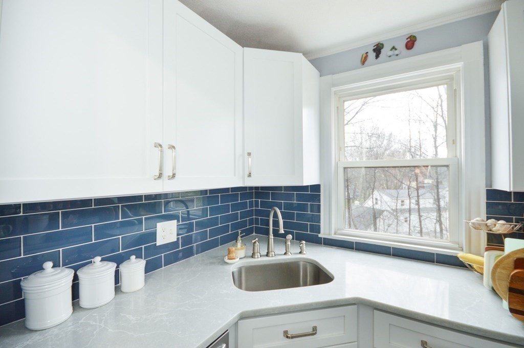 3 Hunnewell Street Melrose, MA 02176 - Photo 8 of 33 a kitchen with a sink and a window