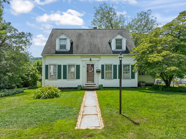 a view of a house with a garden