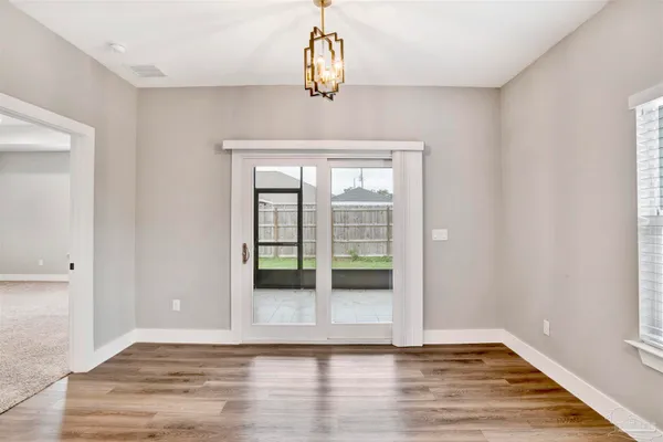 a view of a livingroom with wooden floor