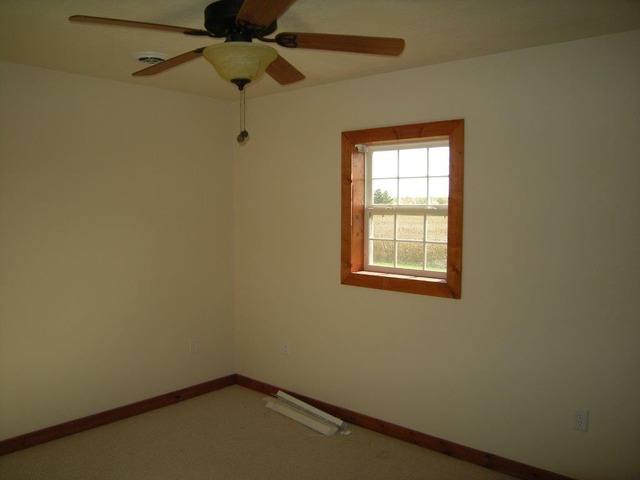 1755 Winding Road Amboy, IL 61310 - Photo 4 of 10 a small space with a window and a ceiling fan