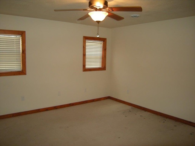 1755 Winding Road Amboy, IL 61310 - Photo 5 of 10 an empty room with a window