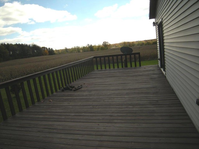 1755 Winding Road Amboy, IL 61310 - Photo 9 of 10 a view of a balcony with wooden floor