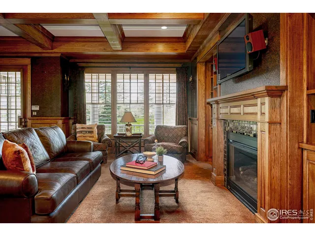 a living room with furniture and a window with outer view