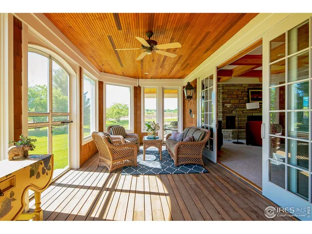 a terrace with outdoor seating and city view
