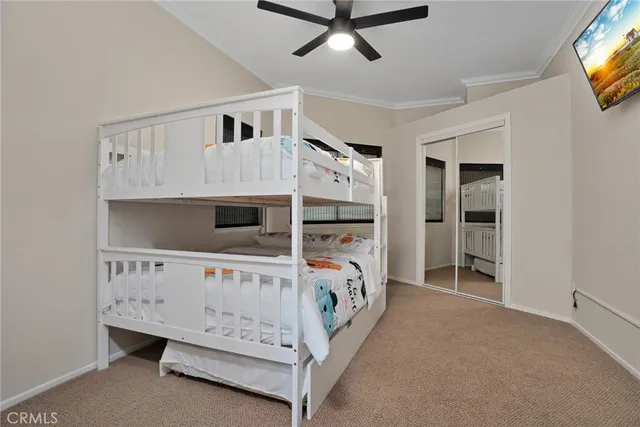 a bedroom with furniture and a tv