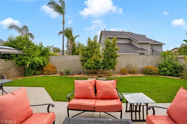 a view of a yard with furniture