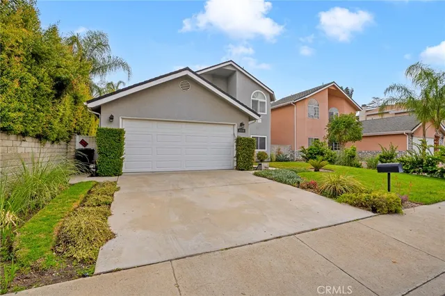 a front view of house with garage and yard