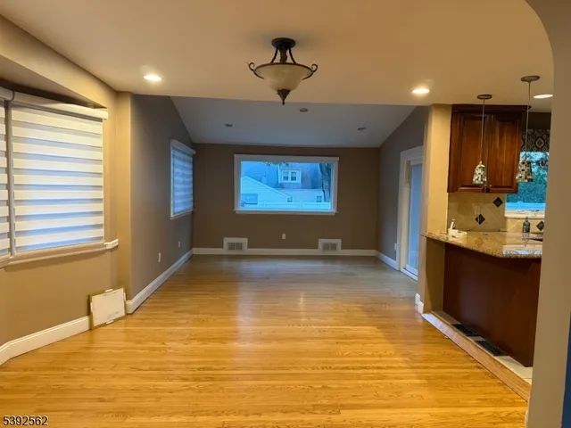 a view of kitchen and window with a ceiling fan