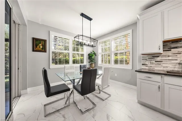 a view of a kitchen with granite countertop cabinets and outdoor view