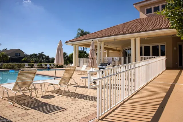 a view of swimming pool with outdoor seating