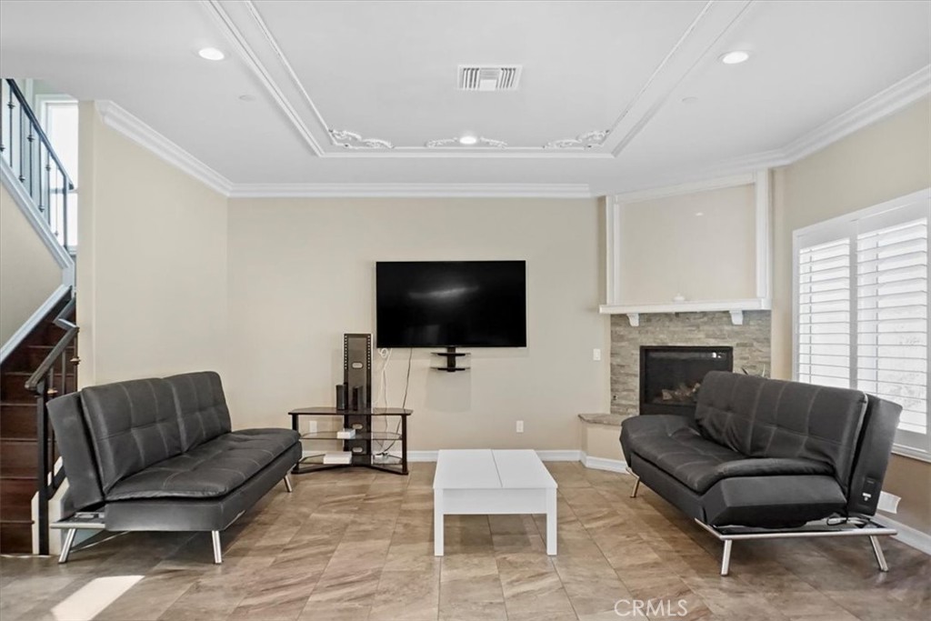 14012 Quailridge Drive Riverside, CA 92503 - Photo 11 of 44 a living room with furniture and a flat screen tv