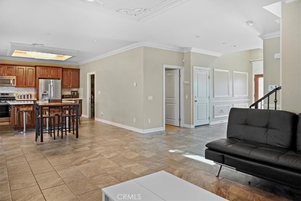 14012 Quailridge Drive Riverside, CA 92503 - Photo 17 of 44 a living room with furniture and a dining table