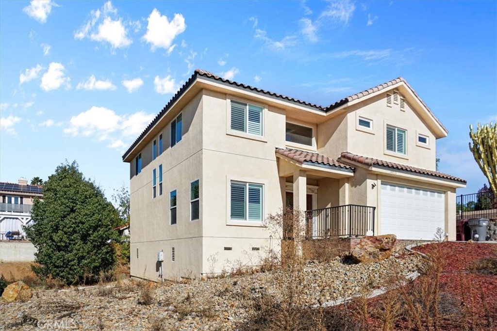 14012 Quailridge Drive Riverside, CA 92503 - Photo 2 of 44 a front view of a house with a yard