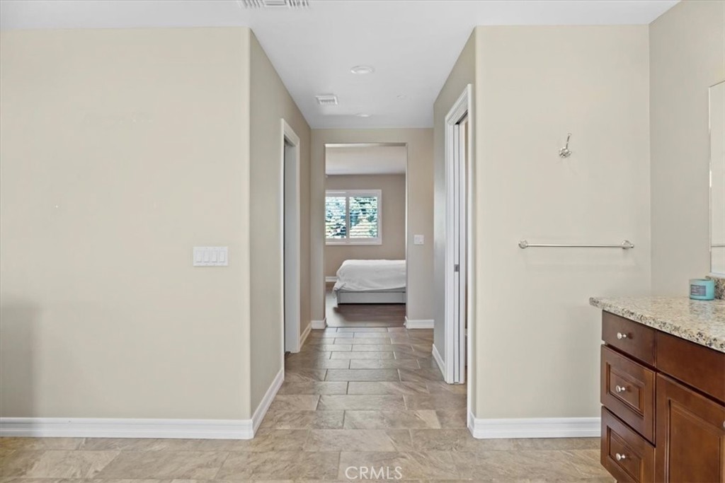 14012 Quailridge Drive Riverside, CA 92503 - Photo 28 of 44 a view of a hallway with bathroom and a sink