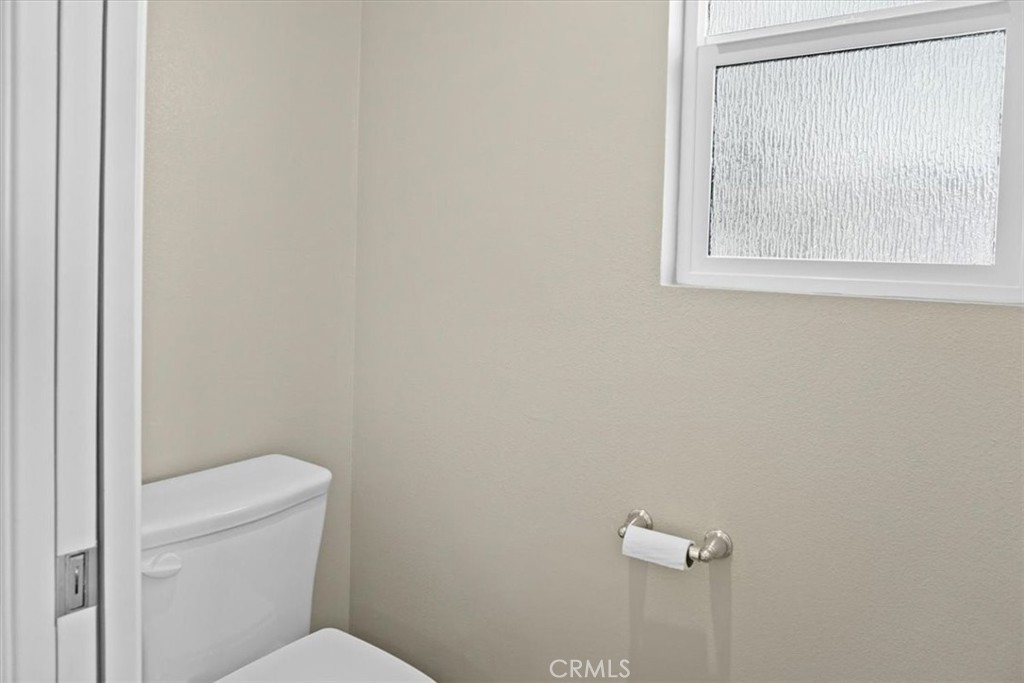 14012 Quailridge Drive Riverside, CA 92503 - Photo 33 of 44 a white toilet sitting next to a window