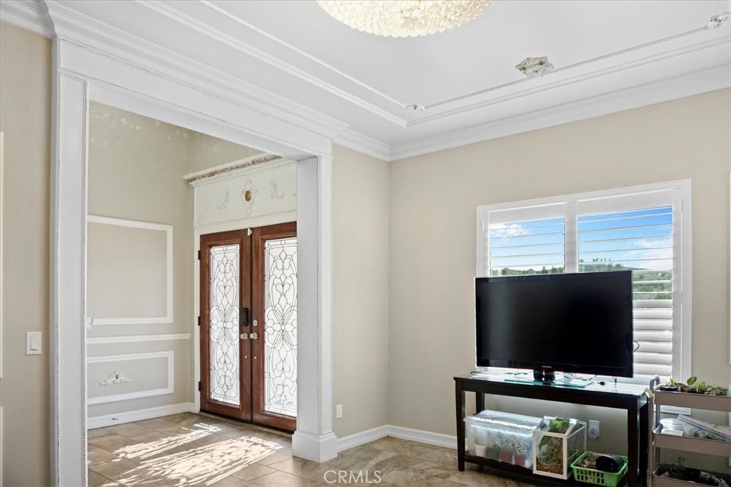 14012 Quailridge Drive Riverside, CA 92503 - Photo 10 of 44 a living room with television and a flat screen tv