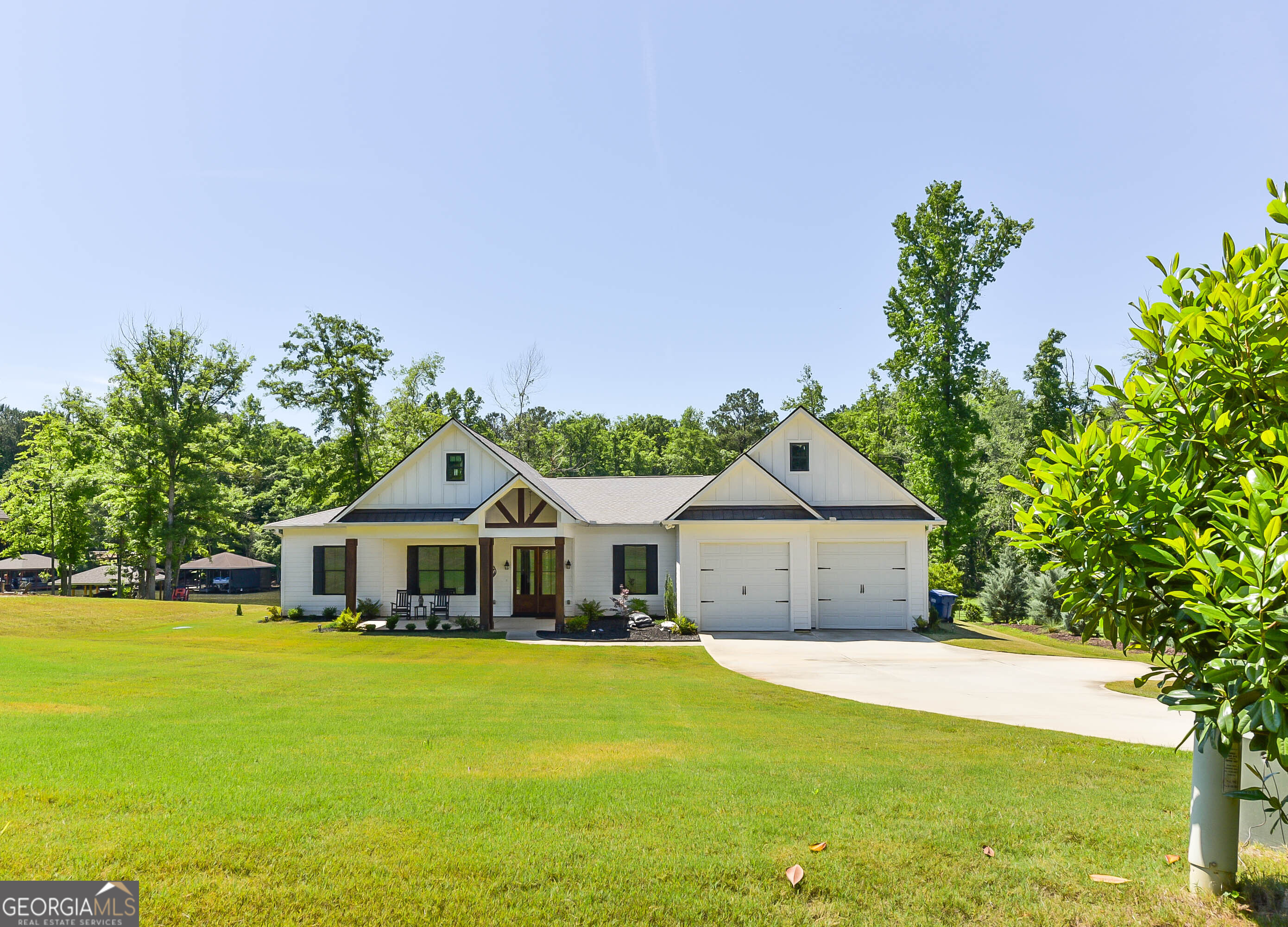 209 Lee Road Salem, AL 36874 - Photo 1 of 37 a front view of a house with a garden and deck