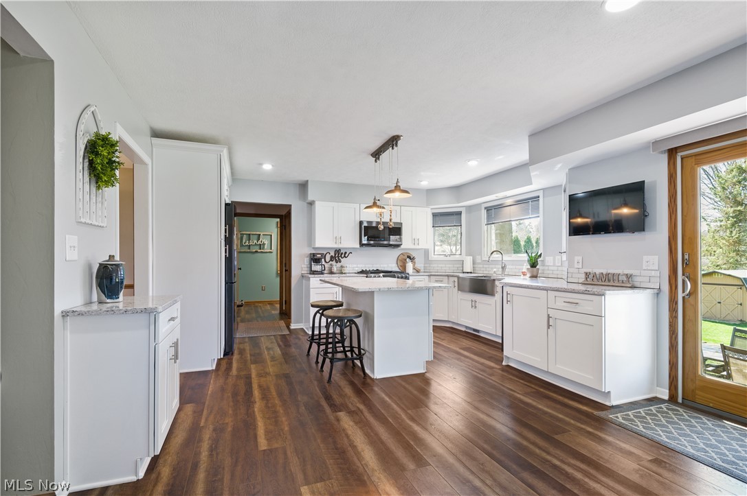 828 Bridge Road Akron, OH 44312 - Photo 9 of 35 Spacious Remodeled Kitchen Features a Center Island