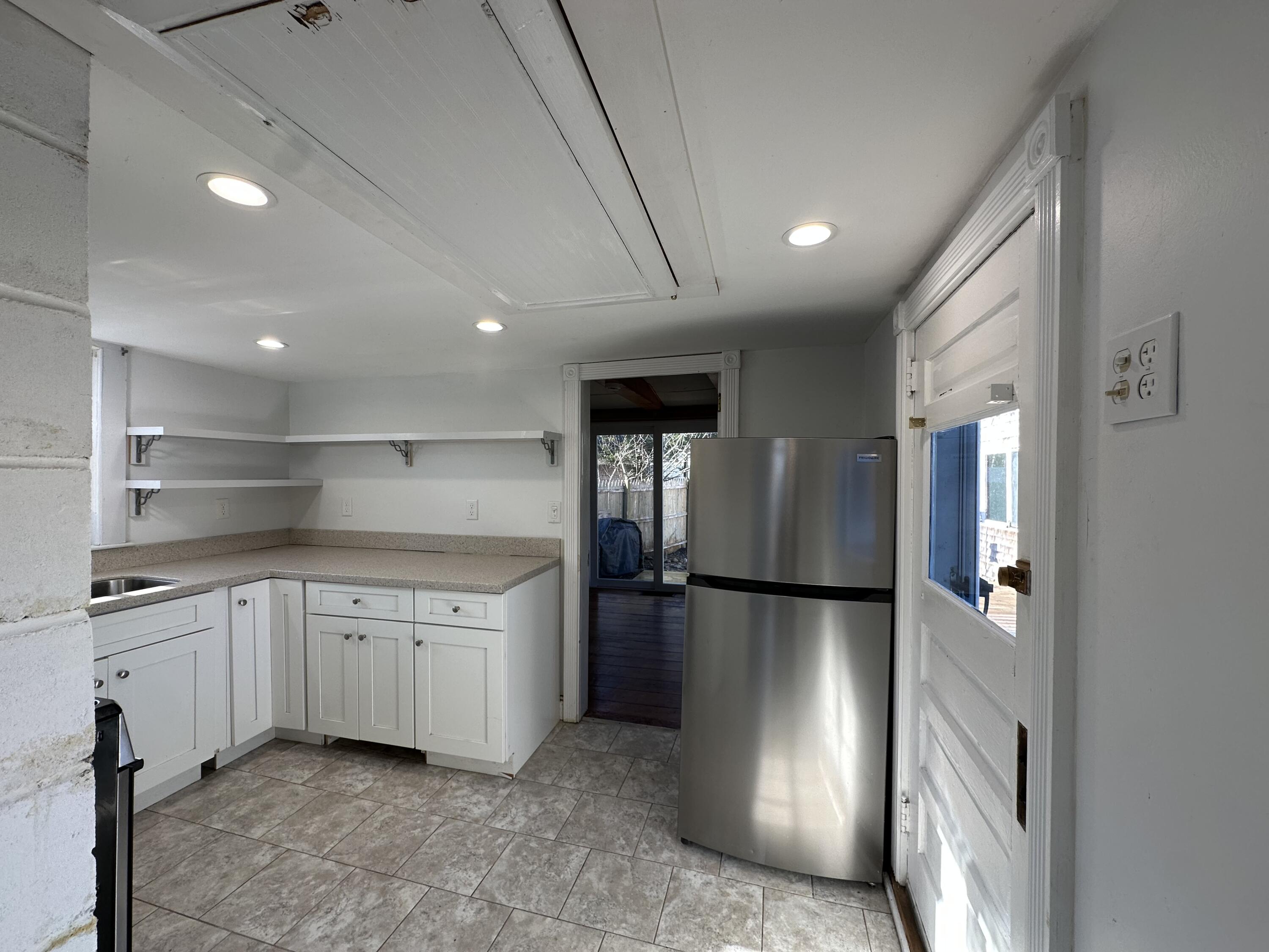 117 Oak Neck Road Hyannis, MA 02601 - Photo 16 of 25 a kitchen with stainless steel appliances granite countertop a refrigerator and a sink
