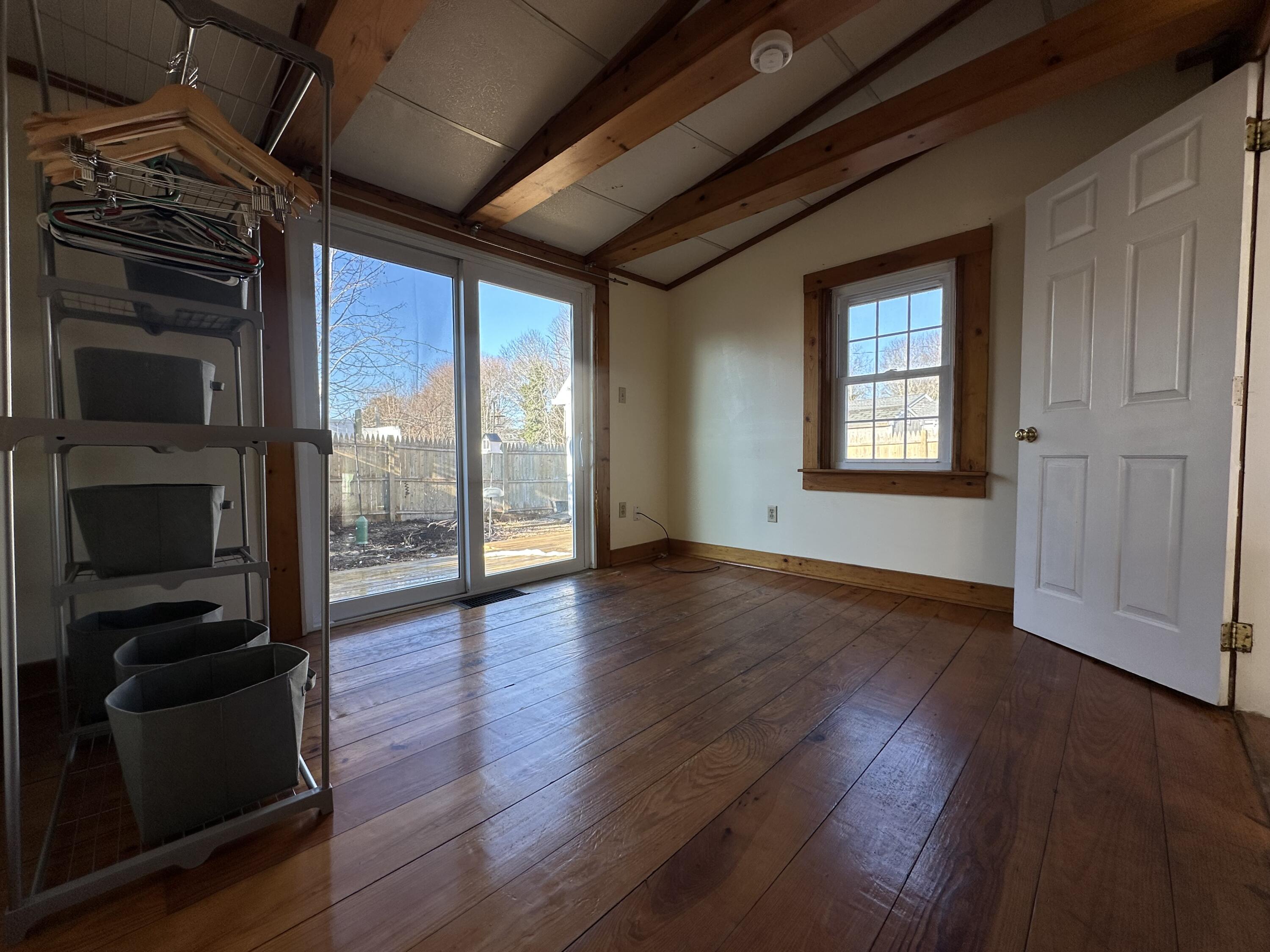 117 Oak Neck Road Hyannis, MA 02601 - Photo 19 of 25 a view of an empty room with wooden floor and a window