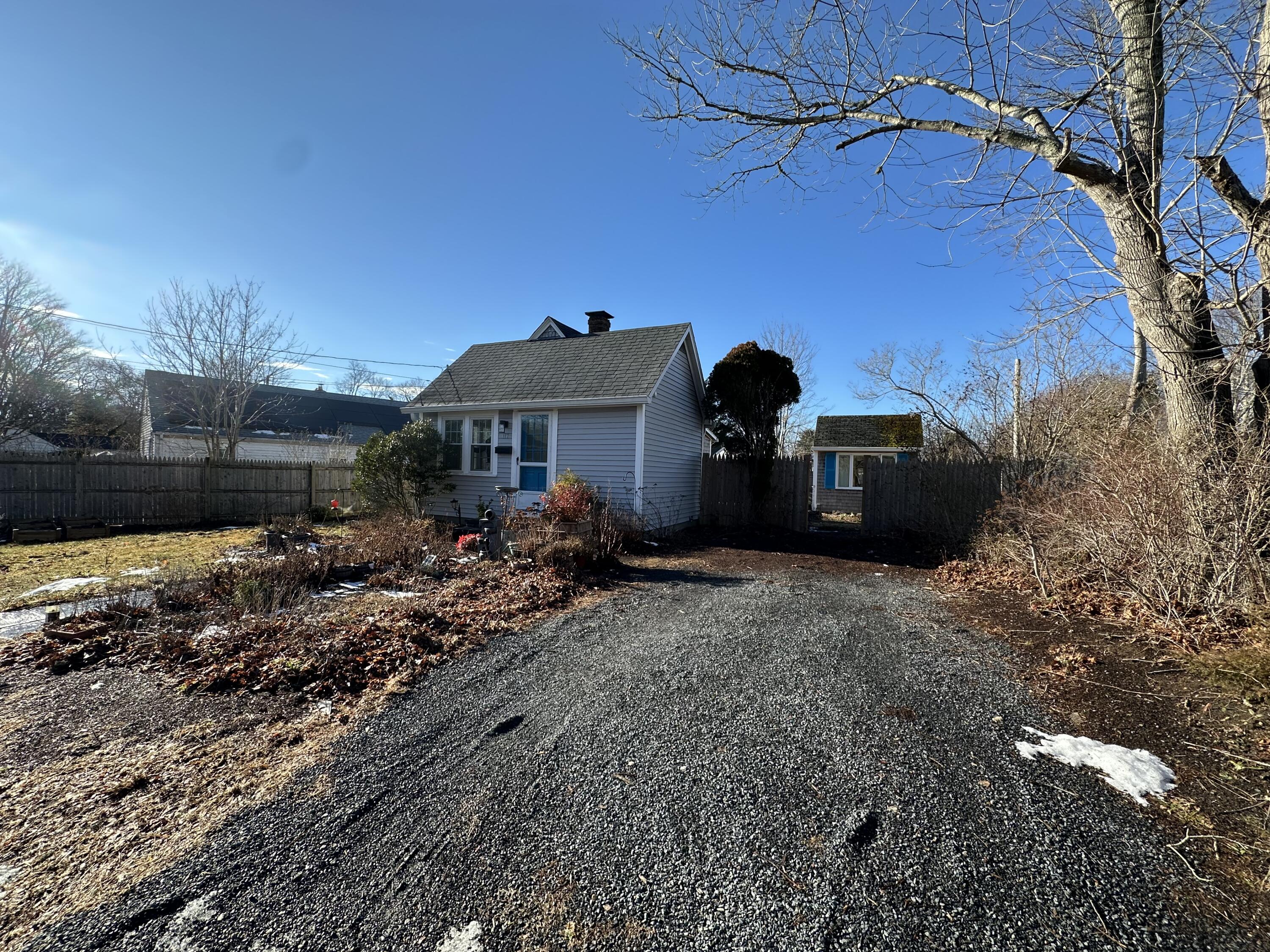117 Oak Neck Road Hyannis, MA 02601 - Photo 7 of 25 a view of a house with a yard and tree s