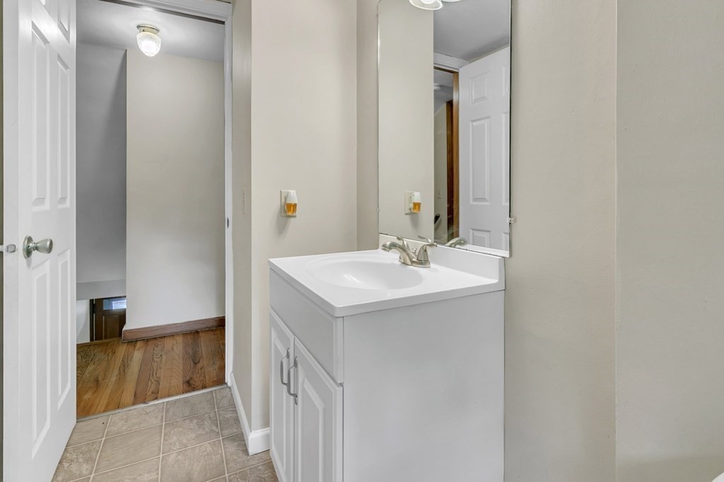 122 Prentice Street Springfield, MA 01104 - Photo 12 of 32 a bathroom with a sink and a mirror