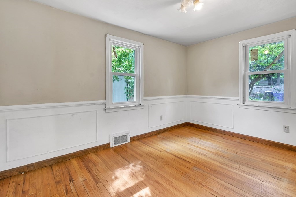 122 Prentice Street Springfield, MA 01104 - Photo 14 of 32 wooden floor in an empty room with a window