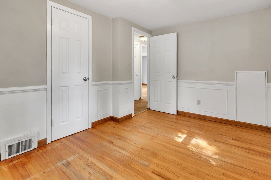 122 Prentice Street Springfield, MA 01104 - Photo 16 of 32 a view of an empty room with wooden floor