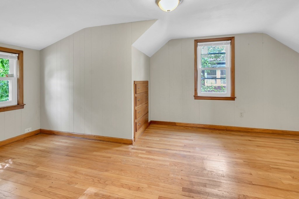 122 Prentice Street Springfield, MA 01104 - Photo 20 of 32 an empty room with wooden floor and windows