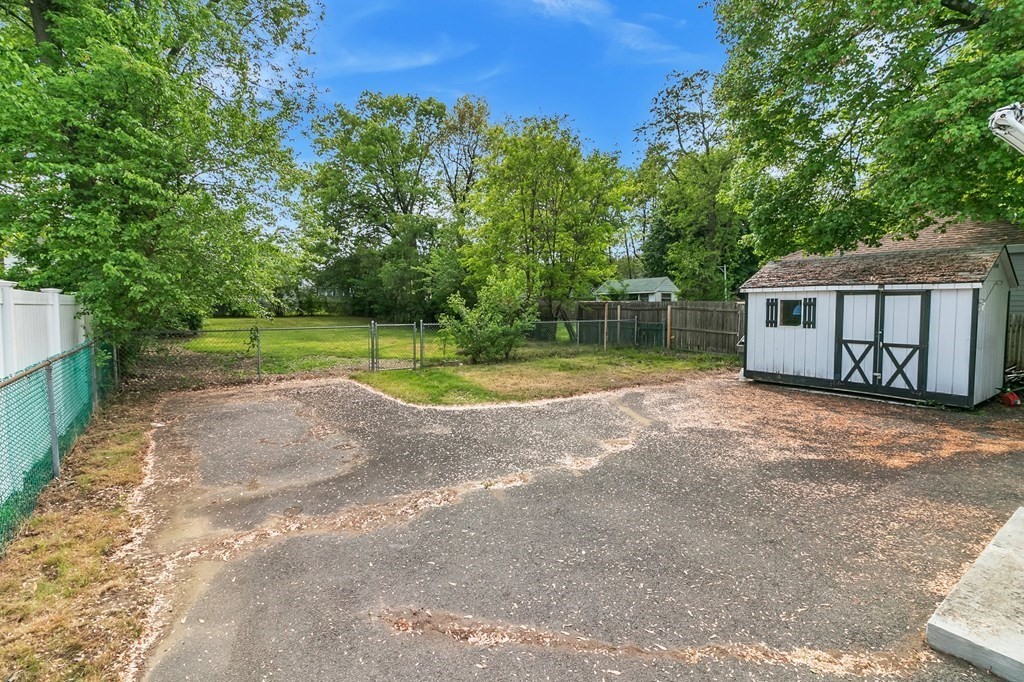 122 Prentice Street Springfield, MA 01104 - Photo 27 of 32 a view of a house with a yard and a garage