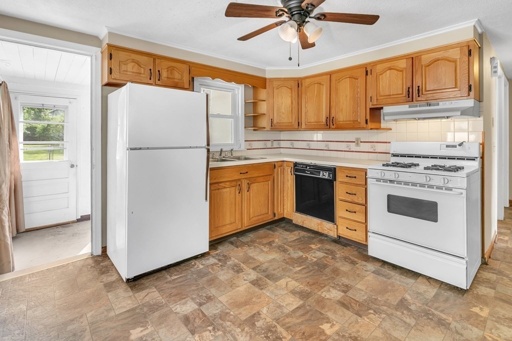 122 Prentice Street Springfield, MA 01104 - Photo 5 of 32 a kitchen with stainless steel appliances granite countertop a refrigerator a stove a sink and a microwave