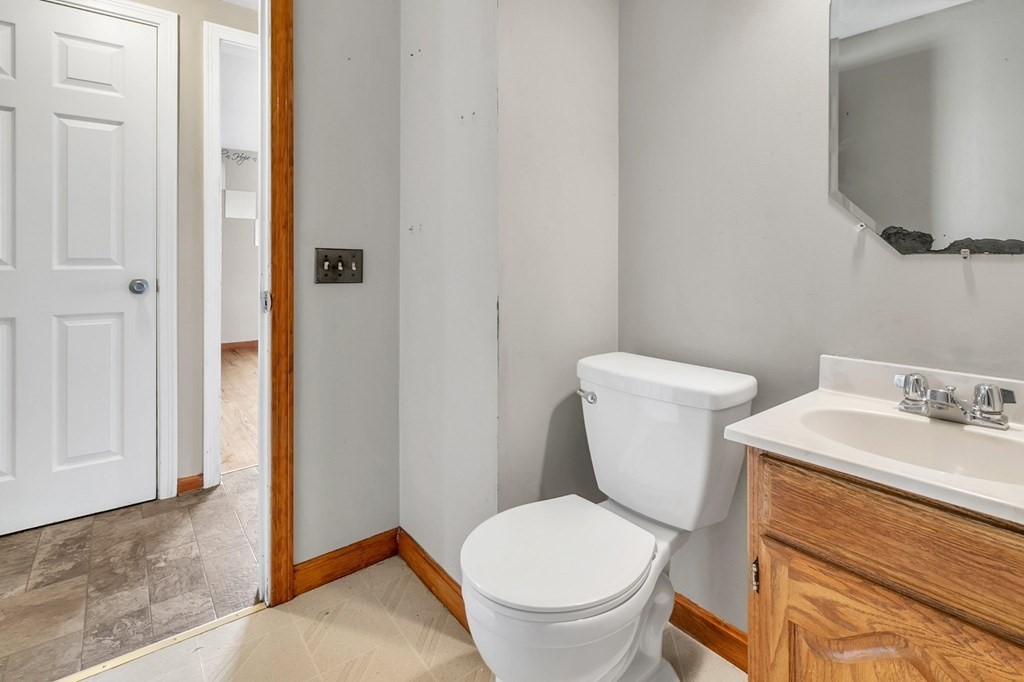 122 Prentice Street Springfield, MA 01104 - Photo 10 of 32 a white toilet sitting next to a bathroom sink