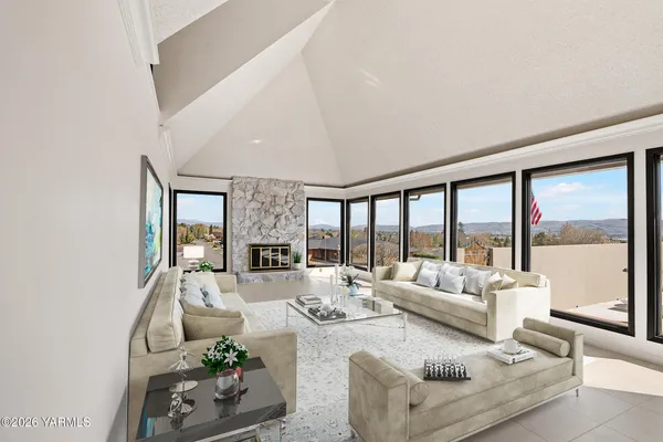 a living room with furniture and a large window