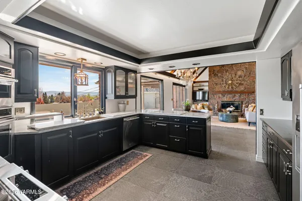 a large kitchen with a large window